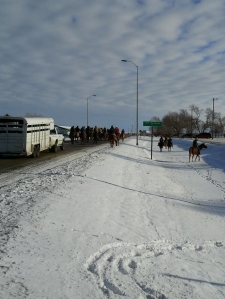 Riders enter Ft. Thompson from the dam site